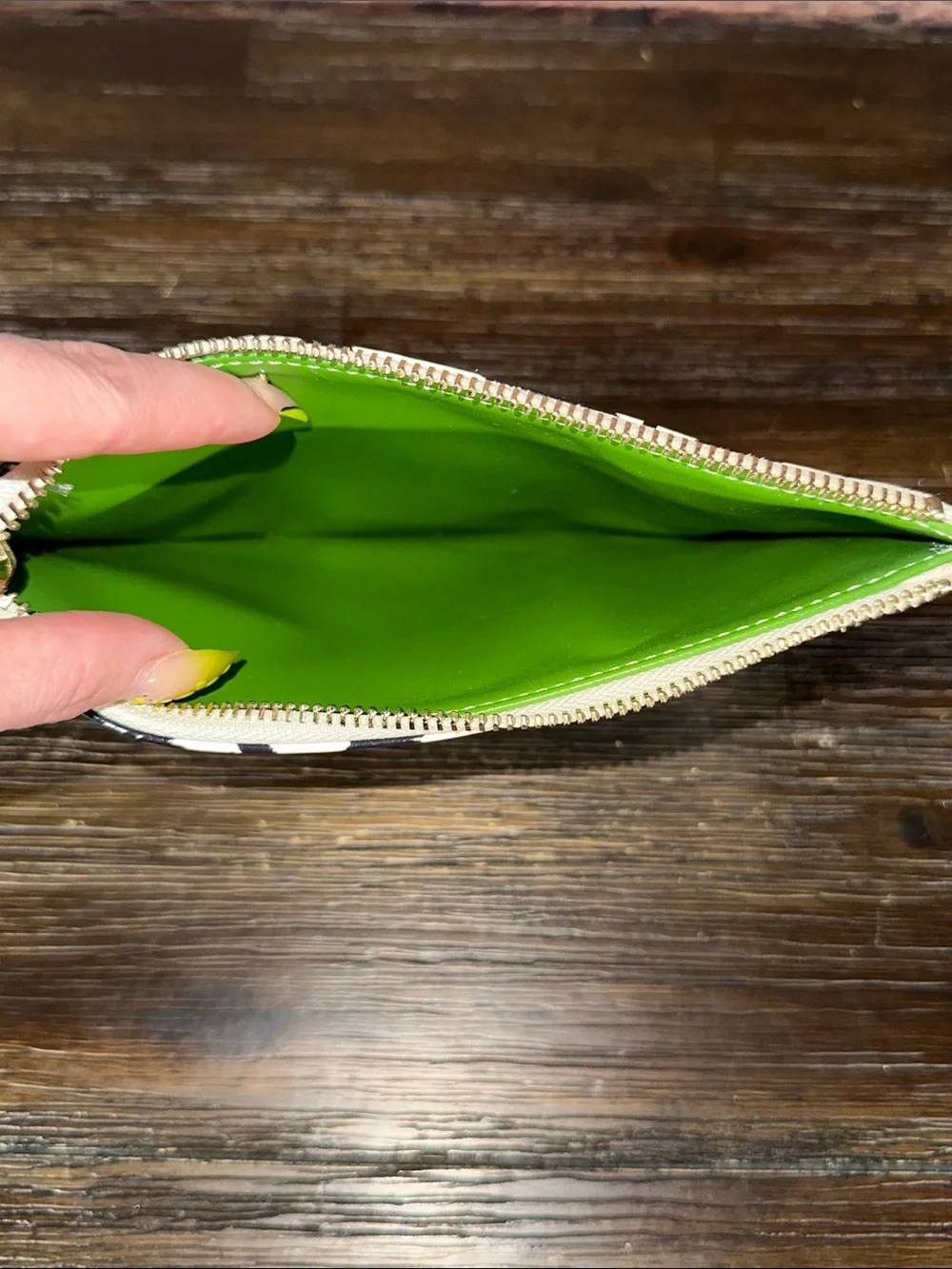 Kate Spade New York pouch features a whimsical 